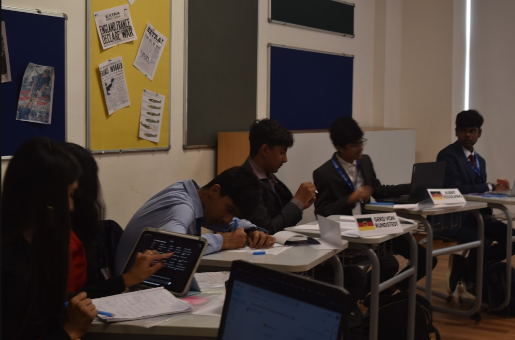 Delegates planning strategy at a whiteboard
